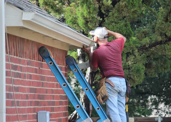Roof maintenance includes gutters and siding repairs on a Buford, GA home
